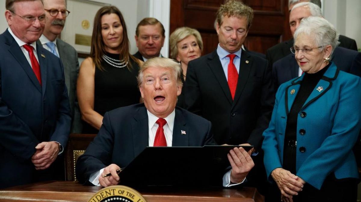 President Donald Trump speaks before signing an executive order on health care in the Roosevelt Room of the White House, Thursday, Oct. 12, 2017, in Washington.