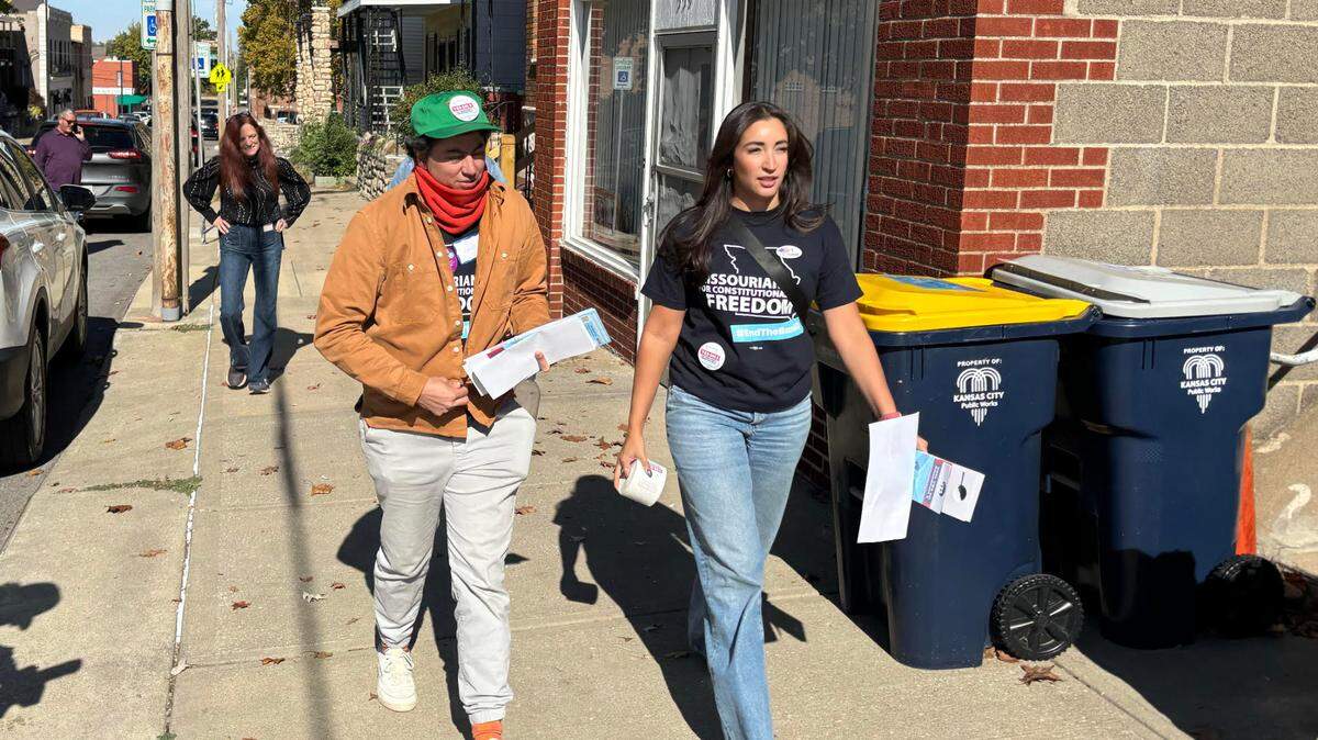 Planned Parenthood Great Plains Votes chief medical officer Iman Alsaden, left, and associate medical director Selina Sandoval go to door to door in support of Amendment 3 and Proposition A in the neighborhood near Columbus Square Park in Kansas City on Saturday.