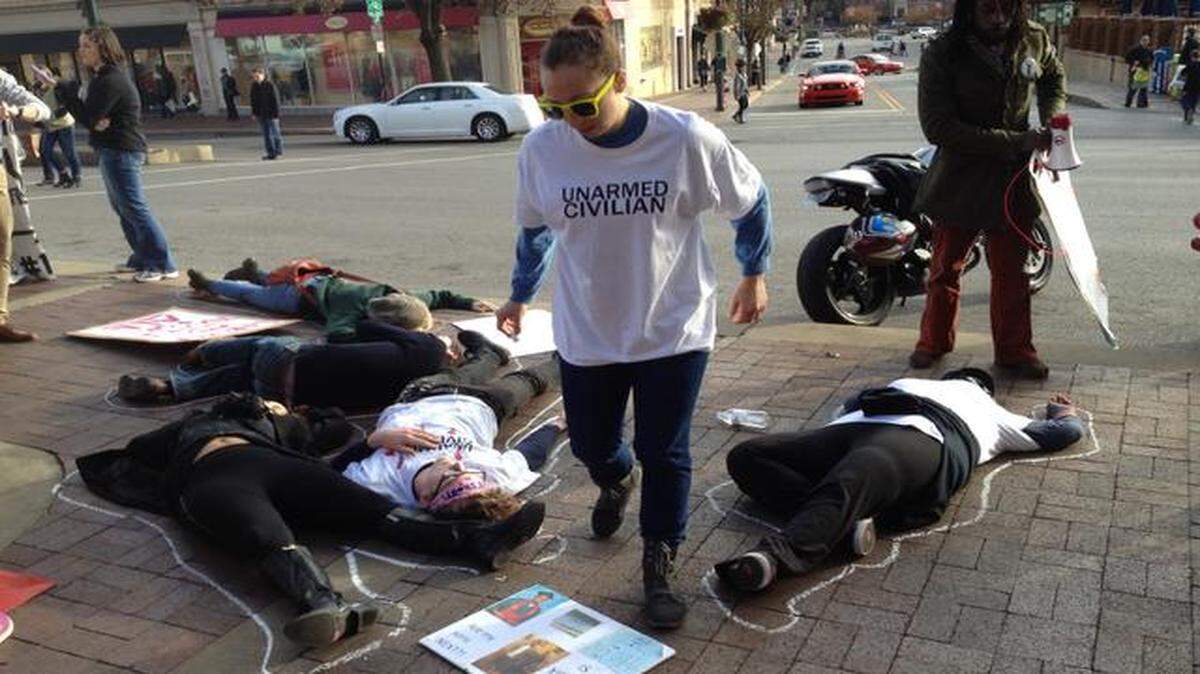 
A handful of protesters on the Country Club Plaza on Friday called out what they saw as excessive violence by police.
