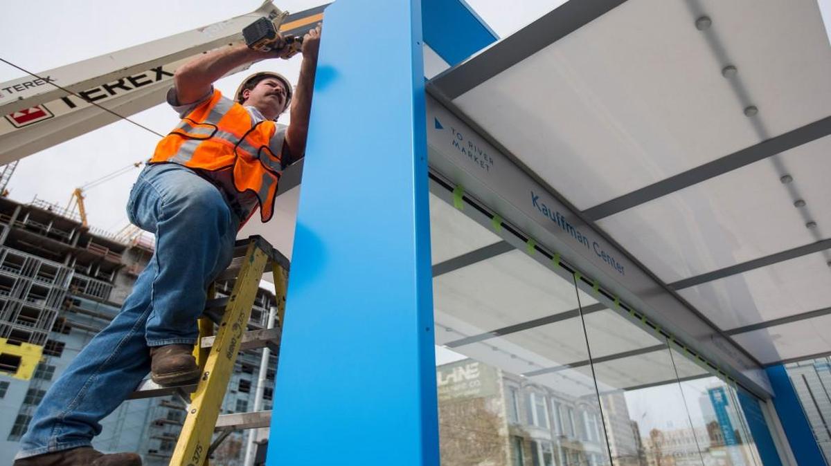 On Monday, Brian Clevenger of Infinity Signs did some installation work at a streetcar station at 16th and Main streets.