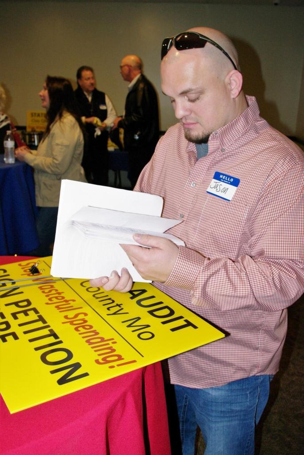 In this 2018 file photo, Jason Withington glanced through stacks of petition signatures in support of an effort to get the Missouri State Auditor to take a close look at Clay County government. That initiative was successful and Missouri State Auditor Nicole Galloway released the findings of her audit on Wednesday.