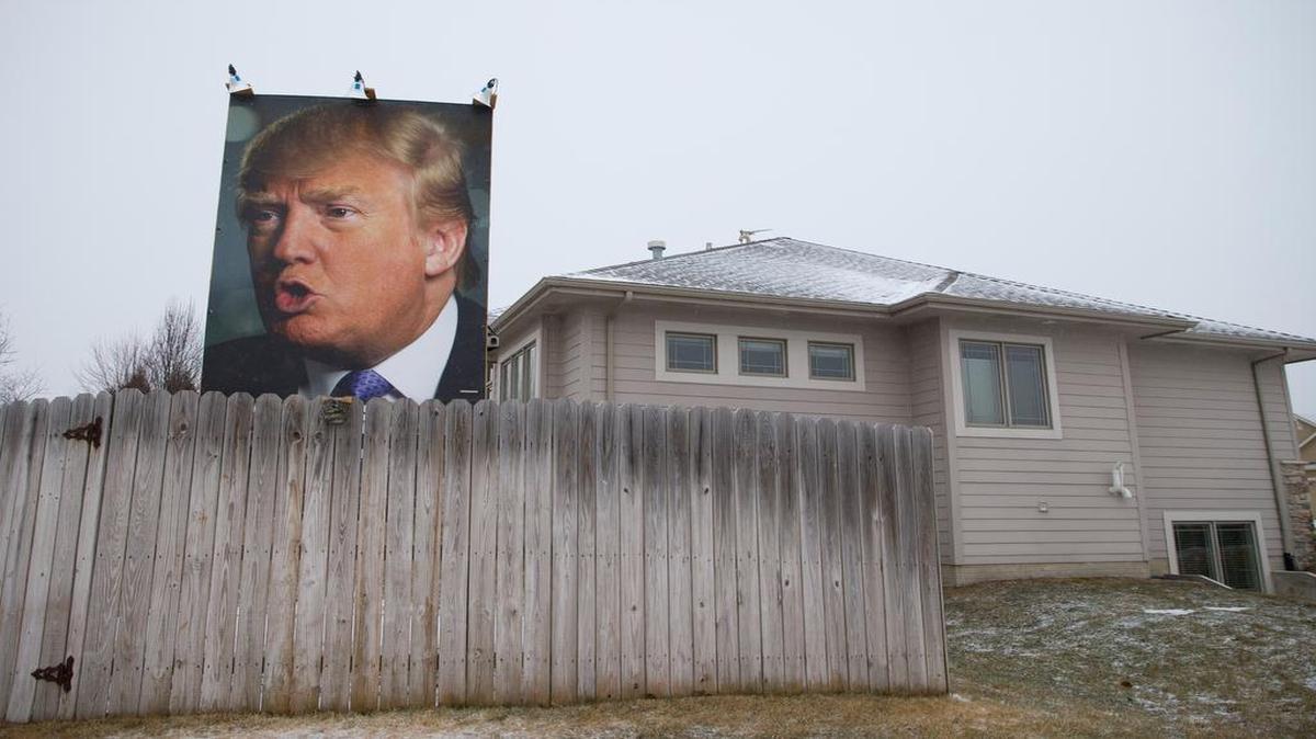 Republican presidential candidate Donald Trump’s image dominates the scene at a home in West Des Moines, Iowa.