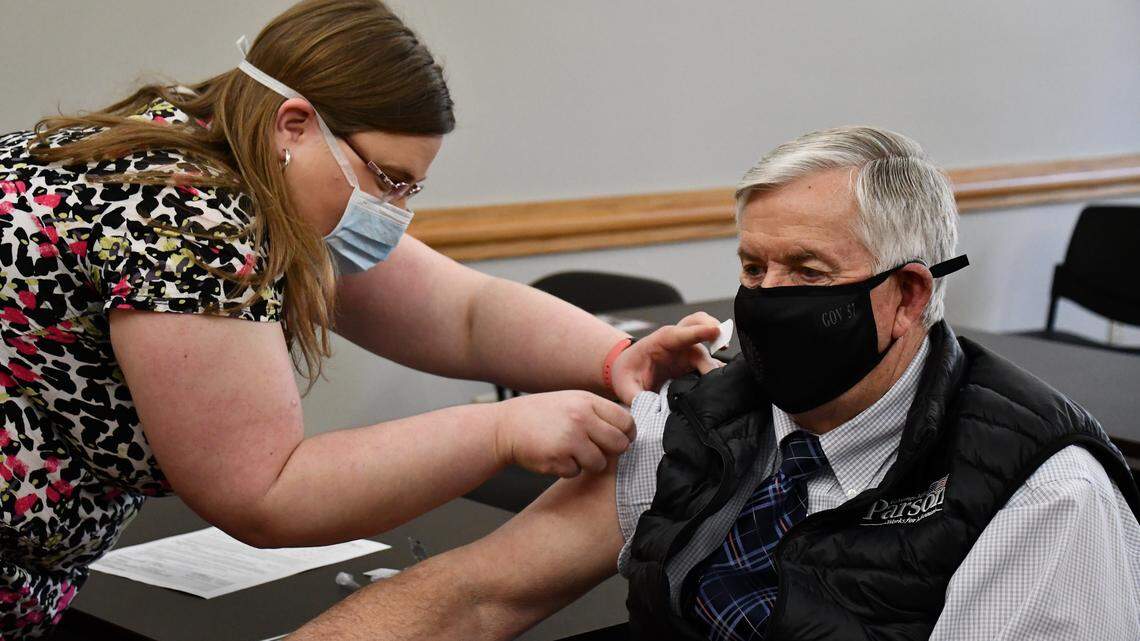 Gov. Mike Parson receives his second dose of the Pfizer vaccine at the Cole County Health Department in March.