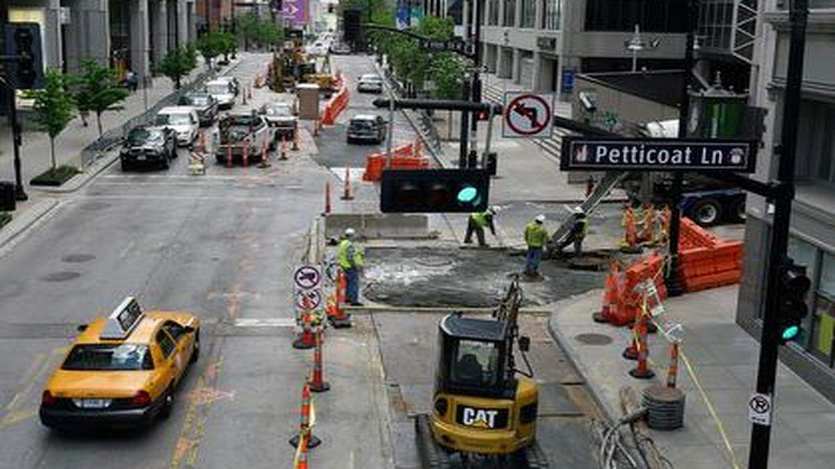 
As the city sought to put an extended streetcar tax district on the Aug. 5 ballot, crews with Black & McDonald working on the current line prepared Main Street on Thursday. 


