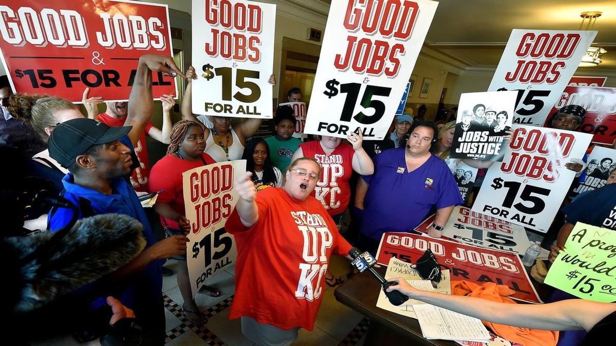 
After months of debate, the Kansas City Council voted Thursday for a minimum wage increase that calls for $13 per hour by 2020. After the vote, Dana Wittman of Stand Up KC (middle) led the cheers just outside the council chambers.

