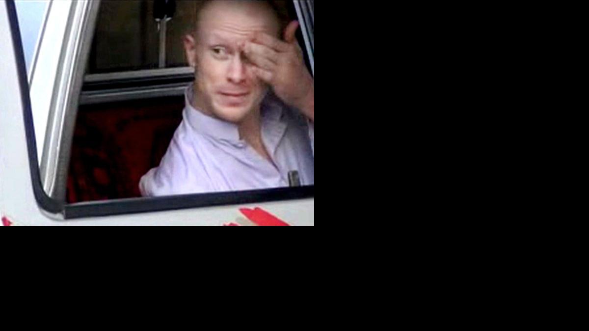 
In this file image taken from video obtained from Voice Of Jihad Website, which has been authenticated based on its contents and other AP reporting, Sgt. Bowe Bergdahl sits in a vehicle guarded by the Taliban.
