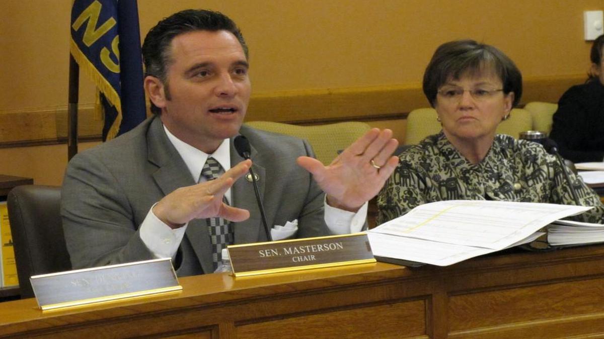 Kansas Senate Ways and Means Committee Chairman Ty Masterson, an Andover Republican, commented on school funding issues during a hearing Wednesday at the Statehouse in Topeka on his plan to redistribute $39 million in state aid to help poor school districts. Watching to his right was Sen. Laura Kelly, a Topeka Democrat.