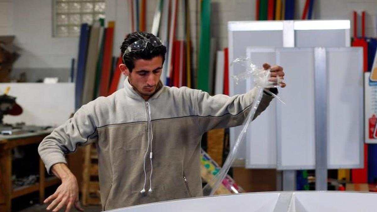 Earlier this week, Syrian refugee Nedal Al-Hayk worked at his job as a fabricator in Warren, Mich. Al-Hayk, who was resettled in suburban Detroit with his family after a three-year wait, said officials interviewed him and his wife in separate rooms, repeatedly asking detailed questions, pressing them about their backgrounds and reasons for fleeing Syria.