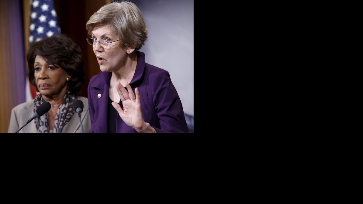 
Sen. Elizabeth Warren, D-Mass., right, and Rep. Maxine Waters, D-Calif., express their outrage to reporters that a huge, $1.1 trillion spending bill passed by the Republican-controlled House
