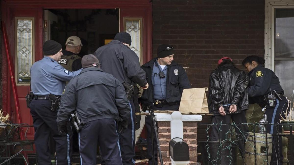 Police officers took people into custody last December as part of the Kansas City No Violence Alliance.