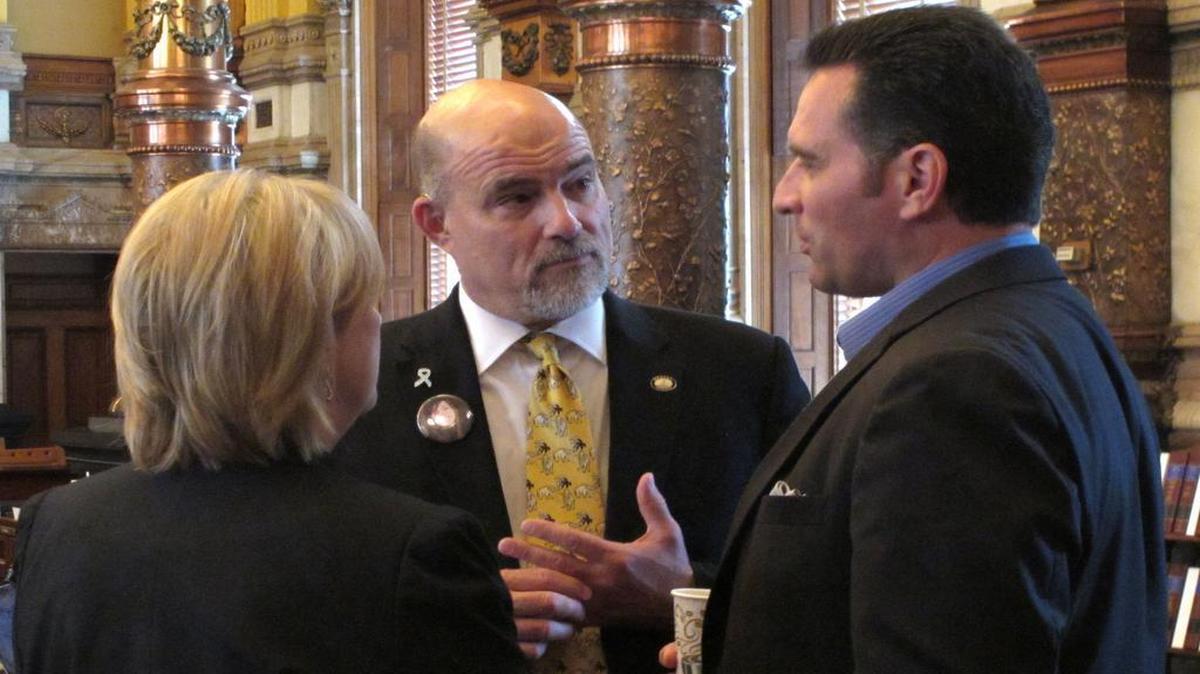 
Kansas state Sen. Greg Smith of Overland Park (center) spoke with fellow Republican Sens. Mary Pilcher-Cook of Shawnee and Ty Masterson of Andover, during the chamber’s debate on a plan for raising taxes to close a budget shortfall Sunday at the Statehouse in Topeka.
