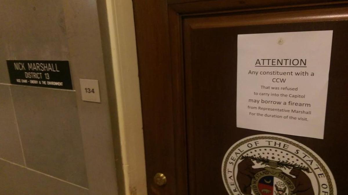 After guns were banned from the Capitol, Rep. Nick Marshall placed a sign on his door offering to lend guns to visiting constituents who have concealed-carry permits.