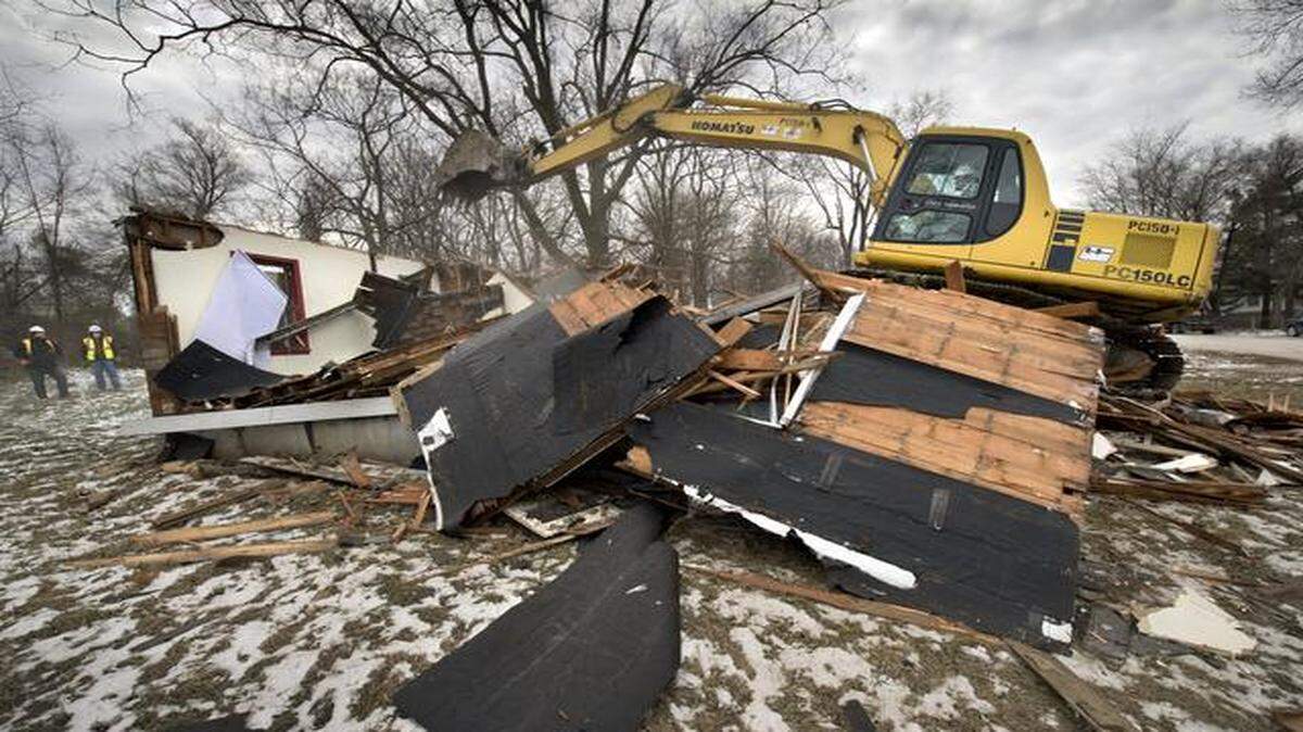 
Kissick Construction started tearing down homes for the city this week. Jeff Padgett’s excavator ripped through a house at 8109 Highland Ave. on Thursday. 

