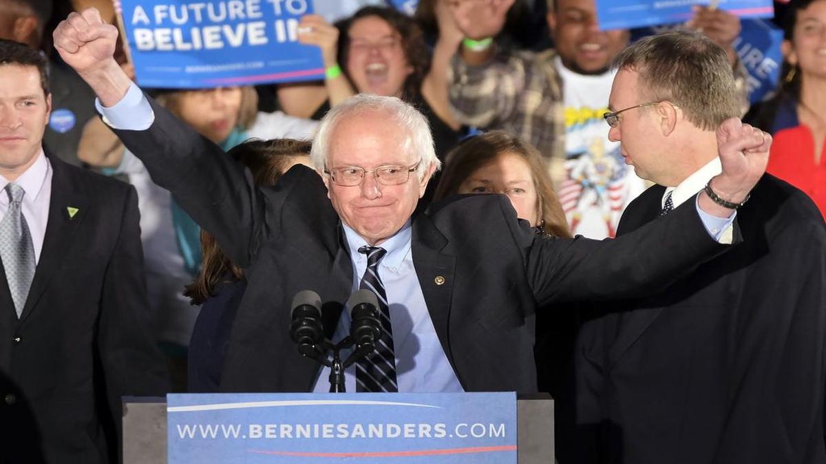 Democratic presidential candidate Sen. Bernie Sanders reacted to the cheering crowd at his primary night rally Tuesday in Manchester, N.H.