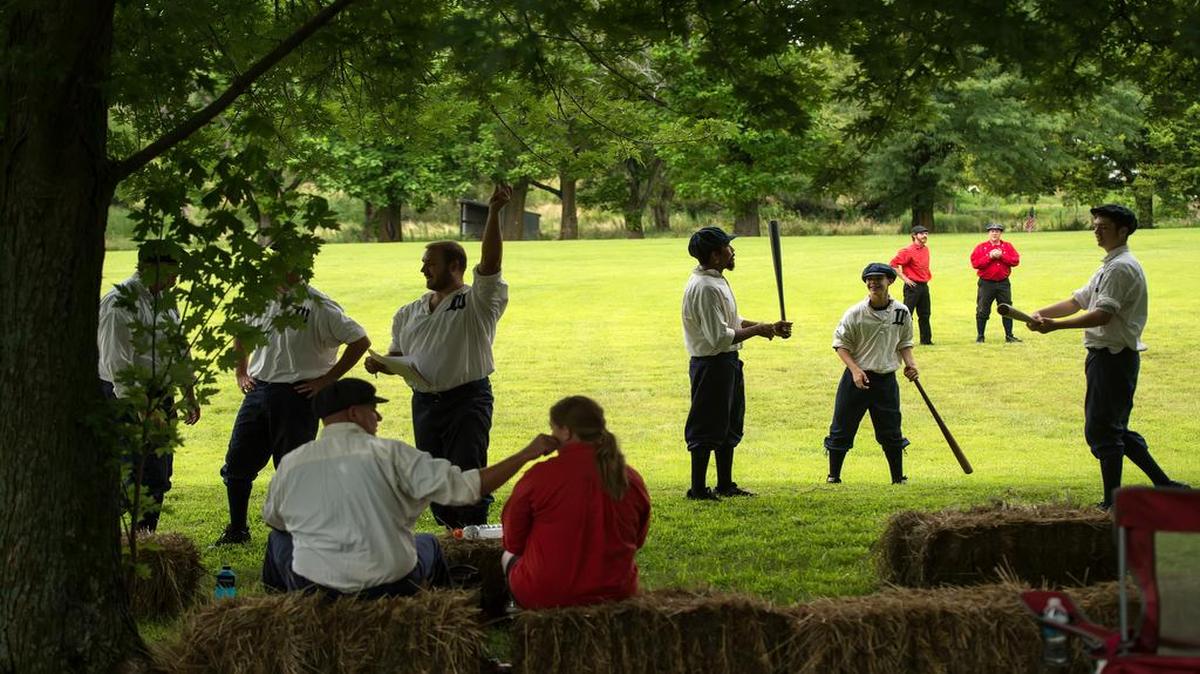 
Two re-created 1860s-era teams prepared to take the field on Saturday at Joe Tinker Day in Muscotah, Kan. The Westerns of Topeka Base Ball Club and the Lincoln Olympic Vintage Base Ball Club played in the grassy outfield because the diamond was muddy. 
