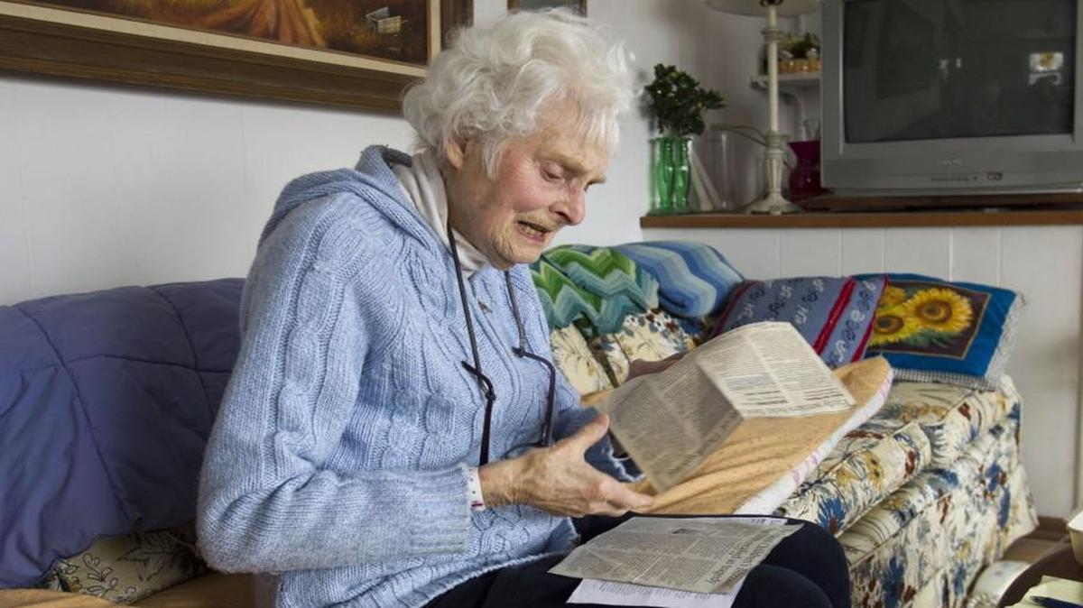 Flipping through a few of her clippings, columnist June Jewett talked about her column and life while at her home on Jan. 9, 2014 in Baldwin City, Kan. Jewett, 93, just missed her first deadline because she couldn’t get down her snow-packed driveway.