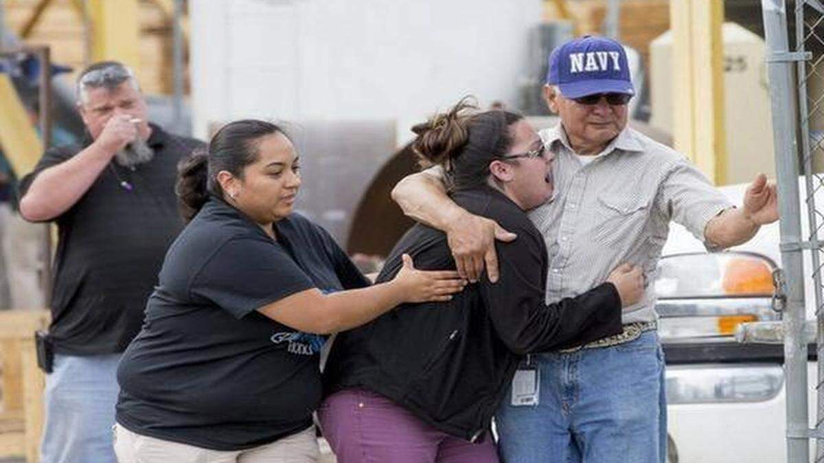 
A woman is overcome with grief after finding out a man was killed in an industrial accident at Boardman, LLC on Tuesday.


