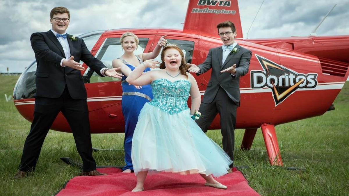 Shaedon Wedel (from right), Carlie Wittman, Taylor Stevenson and Carson Wittman prepared to make a one-of-a-kind entrance to their high school prom on Saturday in Newton, Kan.