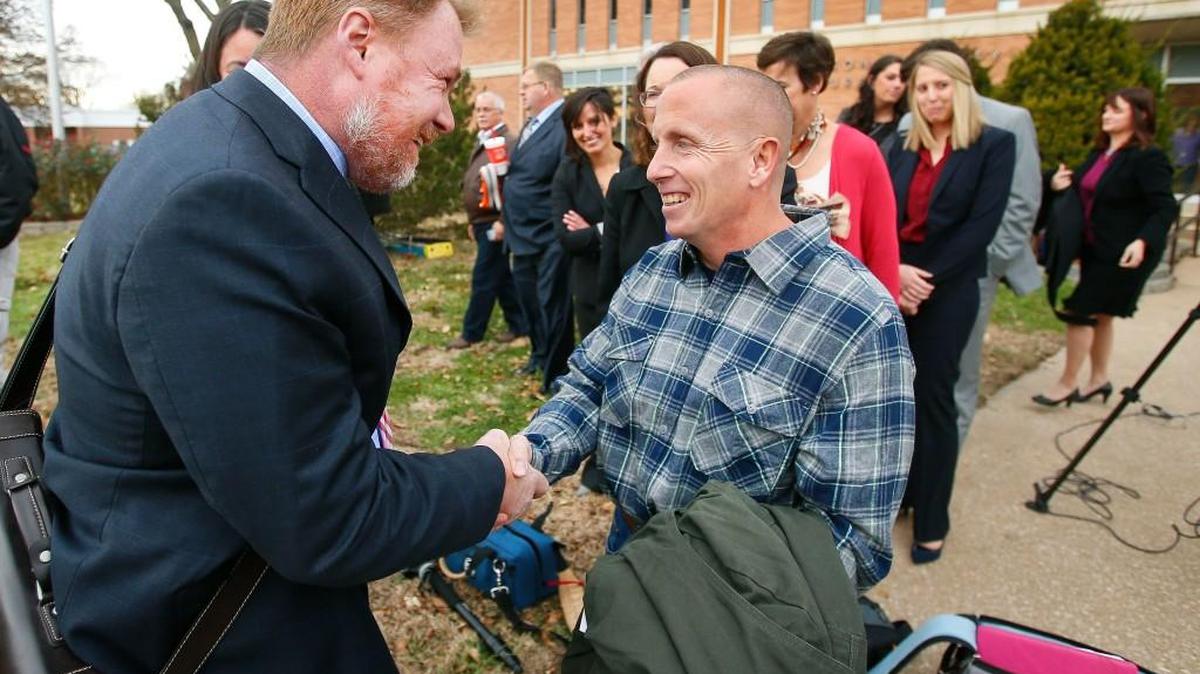 Floyd Bledsoe, right, who served more than 15 years in prison, is greeted by Oliver Burnette, the executive director of the Midwest Innocence Project, after being released by Judge Gary Nafziger Tuesday in Oskaloosa, Kansas.
