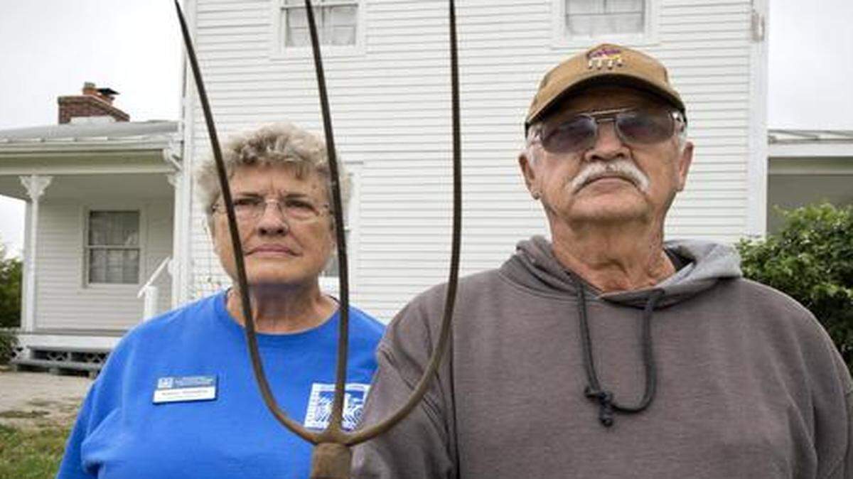 
Karen Meredith and Ray Morgan hope to see the National Agricultural Center and Hall of Fame reopen next summer. They recreated the stern-faced farmer and daughter in “American Gothic,” a copy of which hangs in a building at the center. 
