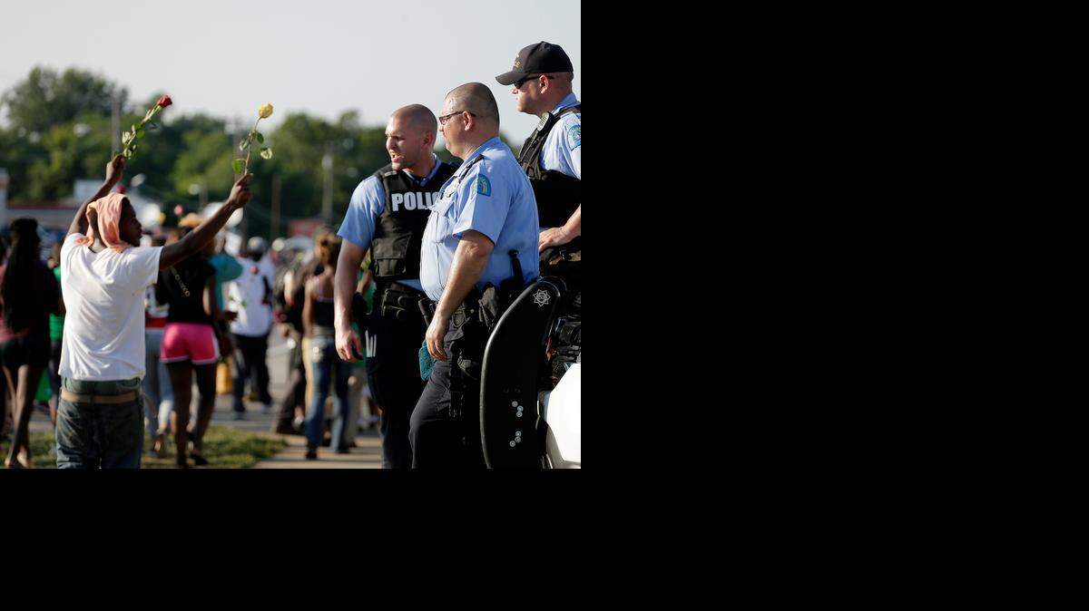 
Protests of the police shooting of Michael Brown, 18, continued Tuesday in Ferguson, Mo. No clashes between demonstrators and police were immediately reported Tuesday night. 
