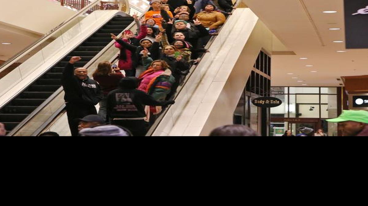 
Protesters of the grand jury decision in the Michael Brown shooting chant slogans at the St. Louis Galleria mall on Wednesday evening, Nov. 26, 2014, in Richmond Heights, Mo. 
