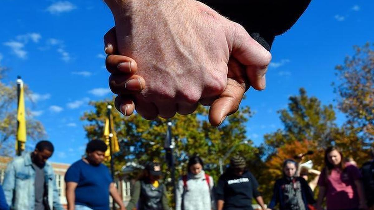 Members of Concerned Student 1950, which led recent protests at the University of Missouri, prayed together Monday. The group wants the school to better address racial issues.