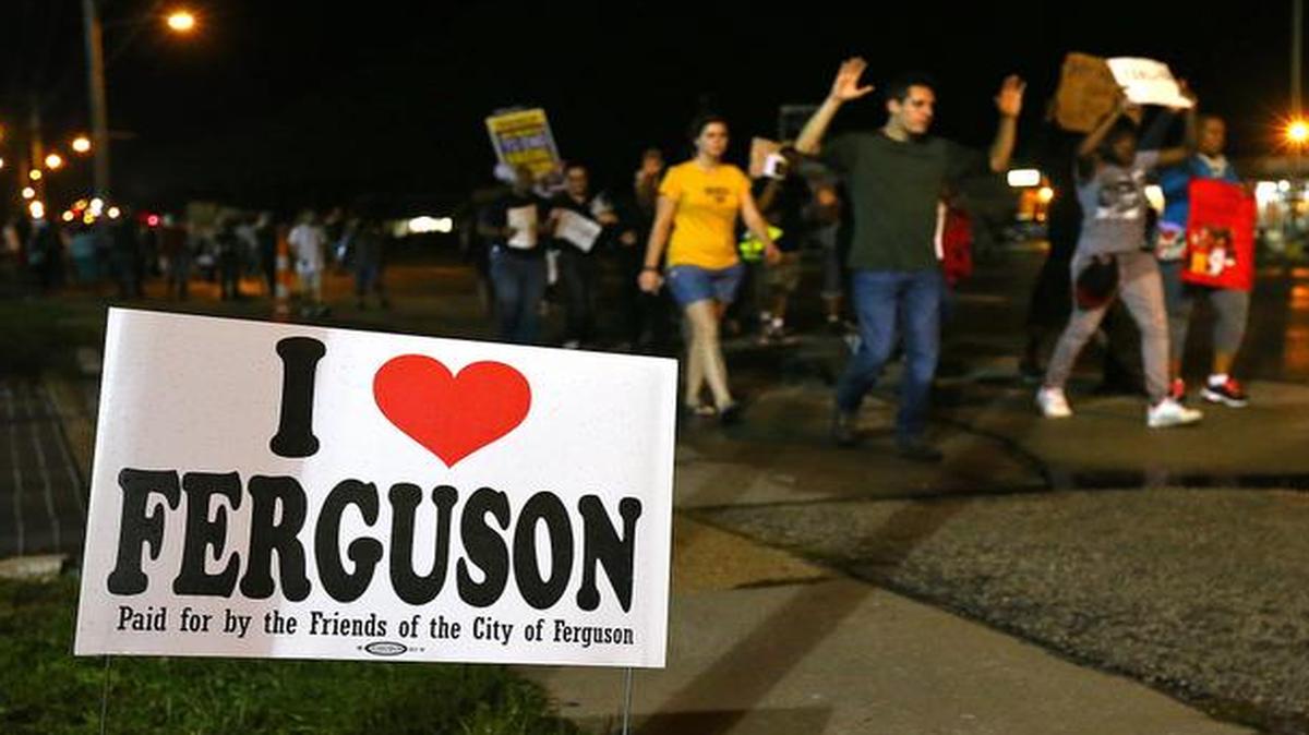 
A small group of protesters marches down West Florissant Avenue in Ferguson, Mo. on Wednesday.
