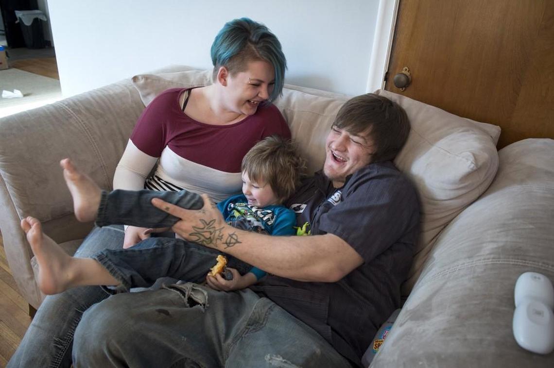 Brittany Koerselman,19, spends some time with her son, Jax, soon to turn 4, and her ex-husband, Jeremie Rook, 24, at her home in Sheldon, Iowa. Now divorced, they are working toward reconciliation.