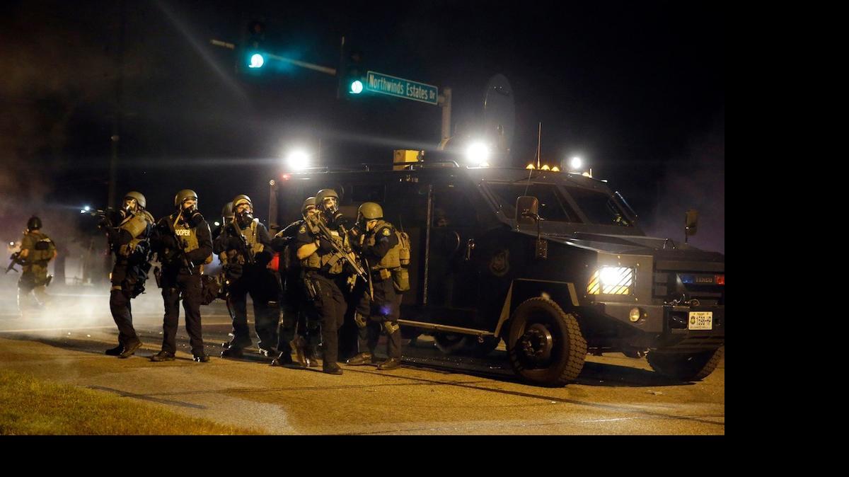 
Police take up positions on Aug. 18, 2014, in Ferguson, Mo.
