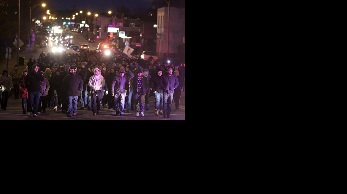 
Bosnians march along Gravois Road Monday in St. Louis
