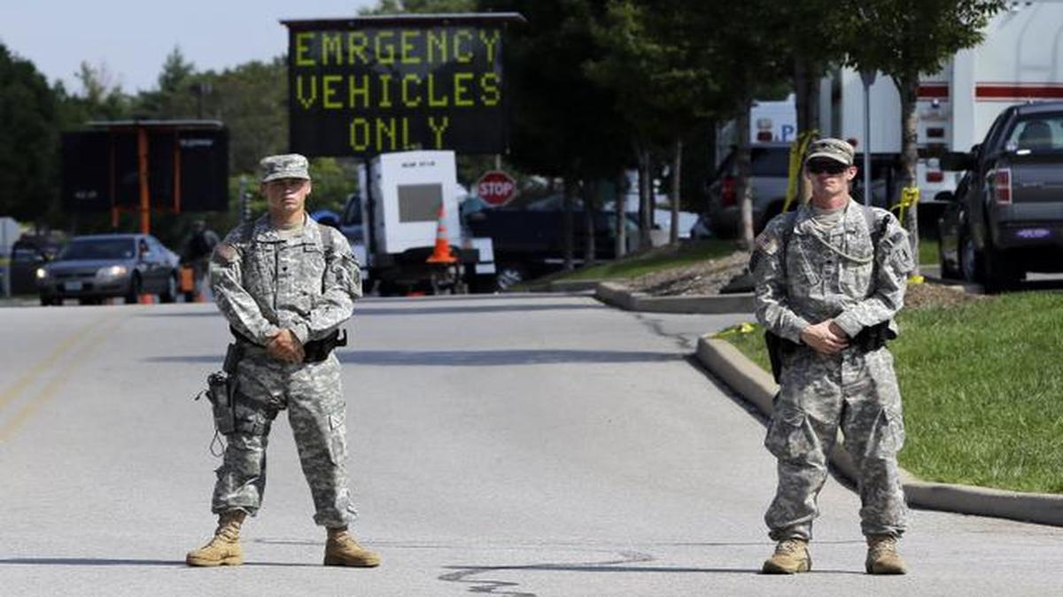 
Members of the Missouri National Guard secured the perimeter of a police command post Tuesday in Ferguson, Mo. 
