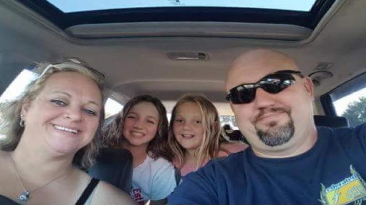 Sarah and Greg Moyers of Leadwood, Mo., died in a car crash Sunday while on vacation to Disney World with their daughters. A GoFundMe page has this photo of the family in their car.