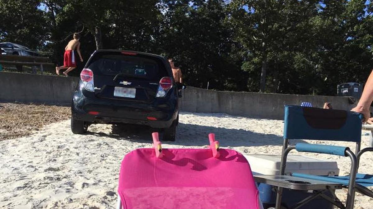 Heather Peterson posted this photo to her Facebook page to show how close a car came to crashing into people on a crowded Missouri beach on Sunday.