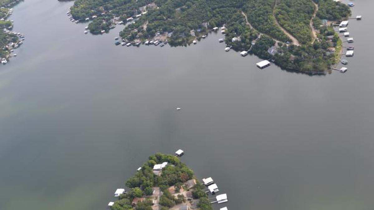 
A handcuffed Brandon Ellingson drowned while in the custody of a state trooper on the Lake of the Ozarks on May 31. In this photo, the boat in the middle of the Gravois Arm is positioned where Ellingson went into the water.
