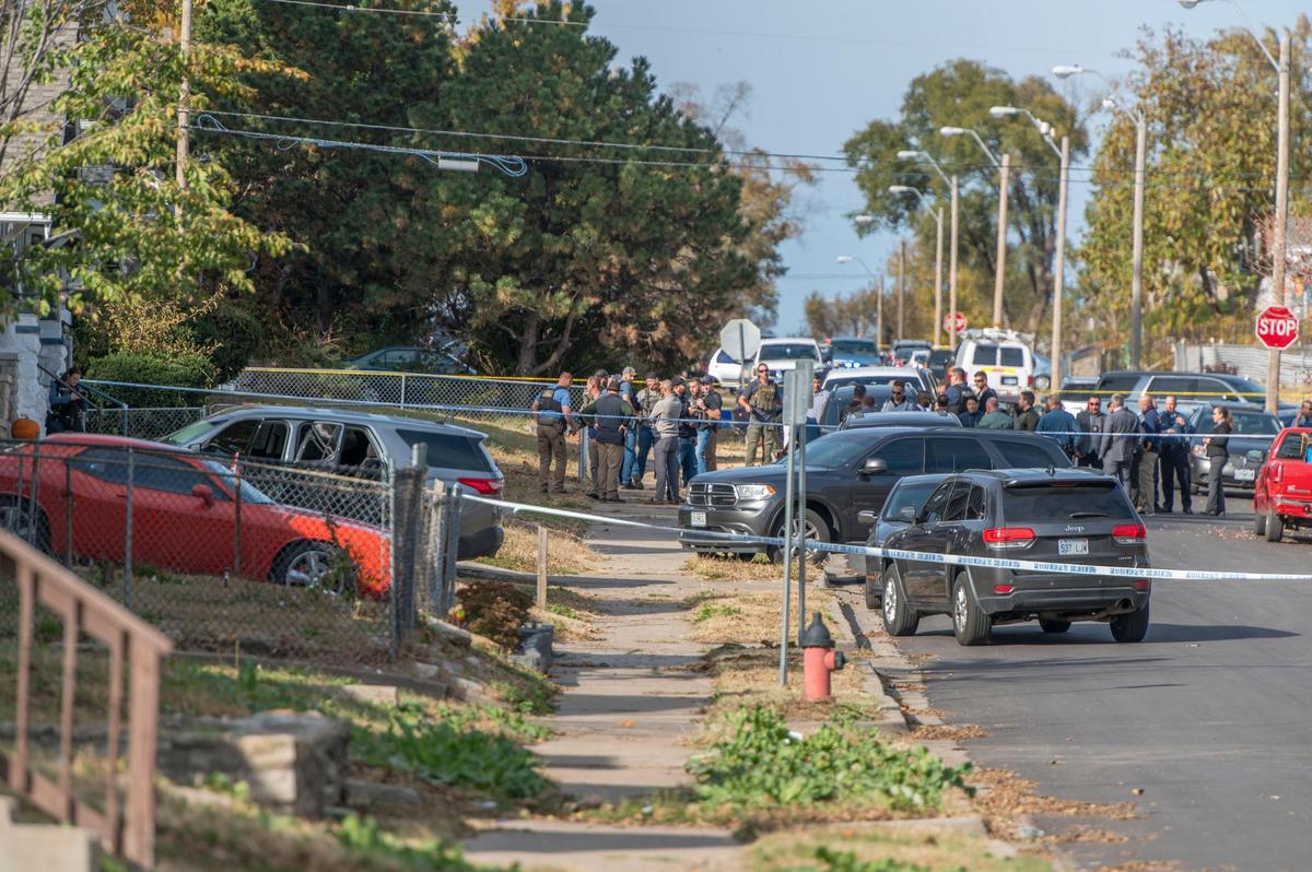 Authorities investigate a police shooting at the 3600 block of Bellefrontaine on Wednesday, Oct. 26, 2022, in Kansas City.