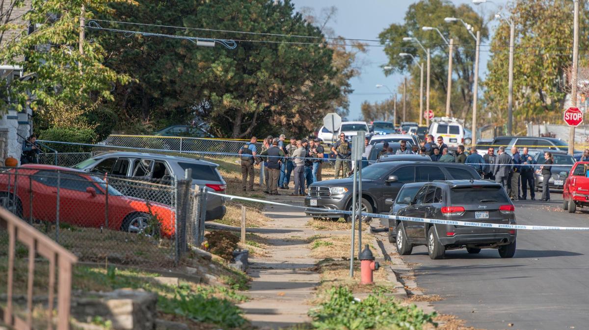 Authorities investigate a police shooting in the 3600 block of Bellefontaine on Wednesday, Oct. 26, 2022, in Kansas City.