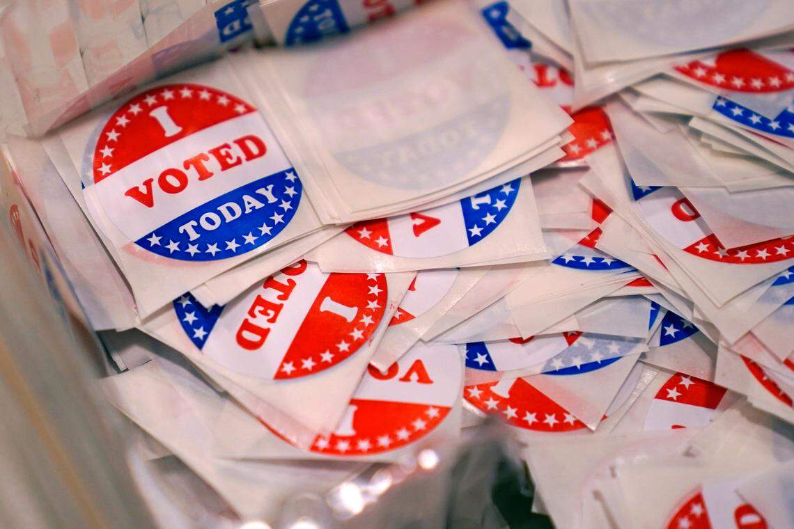 A bin of “I Voted Today” stickers rests on a table at a polling place, Tuesday, Sept. 13, 2022, in Stratham, N.H. (AP Photo/Charles Krupa)