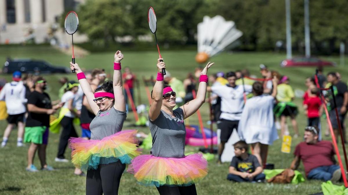 
Carol Wilbeck (left) of Prairie Village and Karen Spence (middle) of Olathe celebrated after they scored a point during Madminton at Theis Park on Sunday. The goal is to raise money for a group called Giving the Basics, a nonprofit that provides the necessities of life not covered by government assistance programs, like soap, shampoo, deodorant, toilet paper and other personal care hygiene products.
