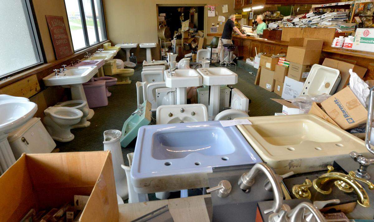 Graham’s showroom floor is a sea of dozens of white and pastel-colored sinks and toilet bowls that rest on the carpet with no price tags attached. Some are for sale, some are waiting to be picked up, some are projects in progress.