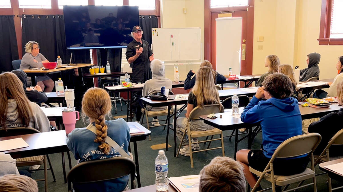 Johnny Rowlands, at front of classroom, has built a curriculum that focuses on keeping young drivers from putting themselves at any more risk than necessary. Simple strategies that are designed, he says, to lessen the likelihood that parents will ever have “to get that phone call.”