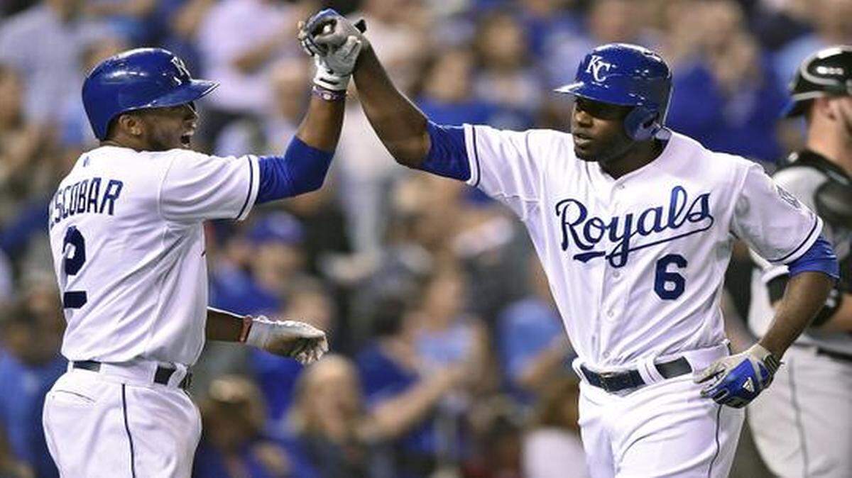 
Alcides Escobar congratulated Lorenzo Cain after Cain hit a three-run home run on Wednesday.

