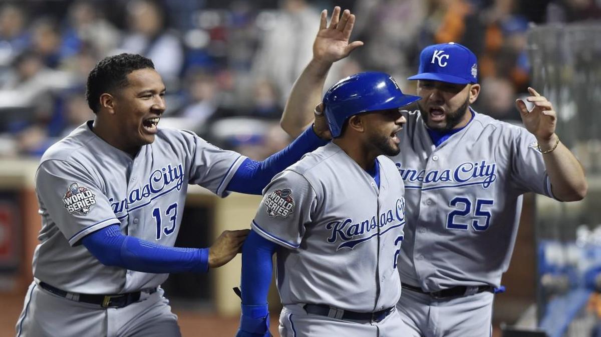 Royals catcher Salvador Perez and designated hitter Kendrys Morales congratulated shortstop Christian Colon after Colon scored in twelfth inning during game 5 of the World Series in New York.