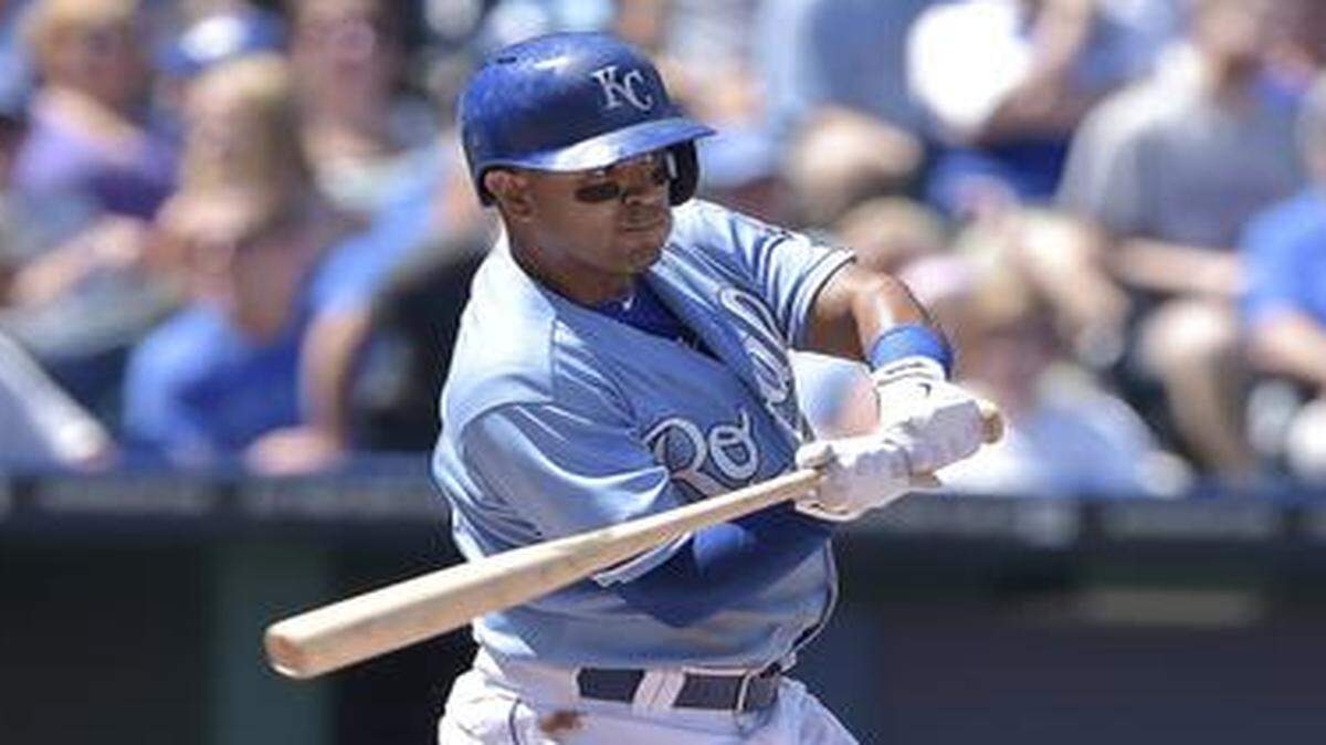 
The Royals' Christian Colon connects on a single against the Athletics during their Aug. 14 game at Kauffman Stadium.
