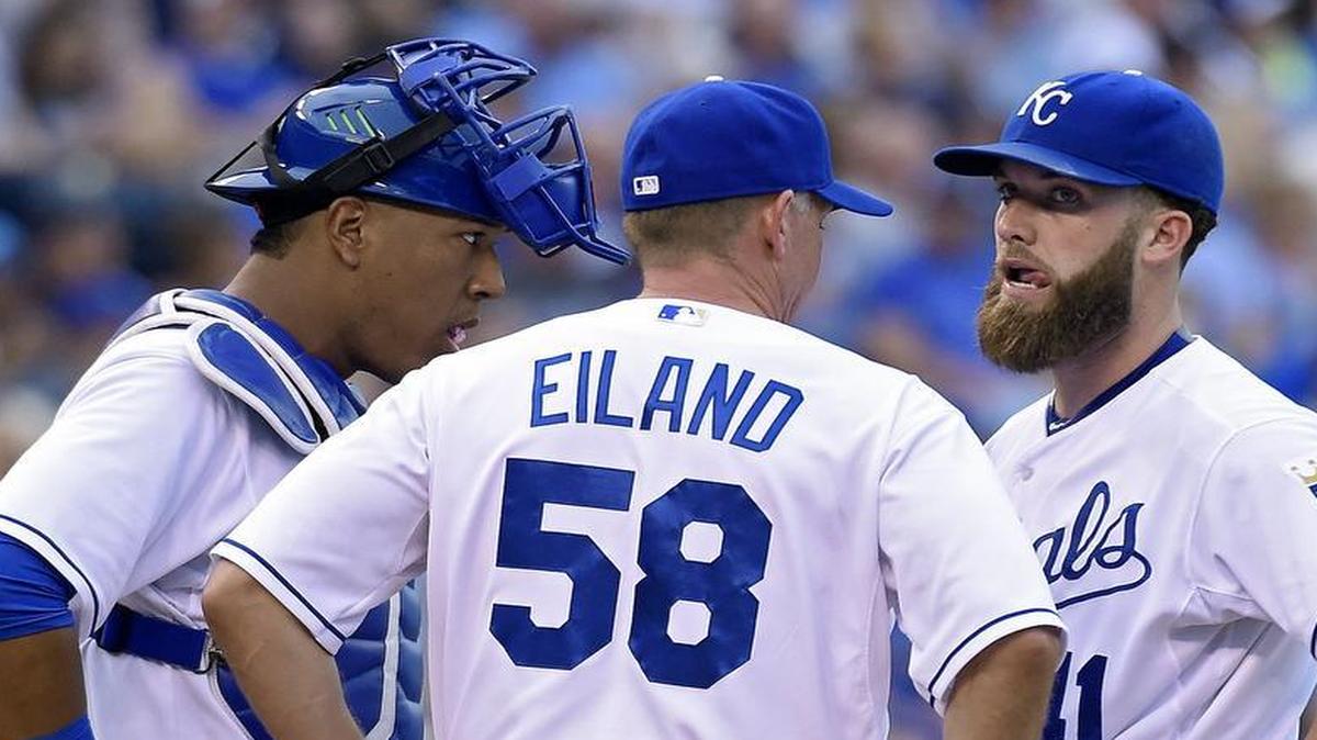 
Royals starting pitcher Danny Duffy (41) and catcher Salvador Perez (13) listen to pitching coach Dave Eiland in the third inning of Saturday's baseball game against the Yankees at Kauffman Stadium.
