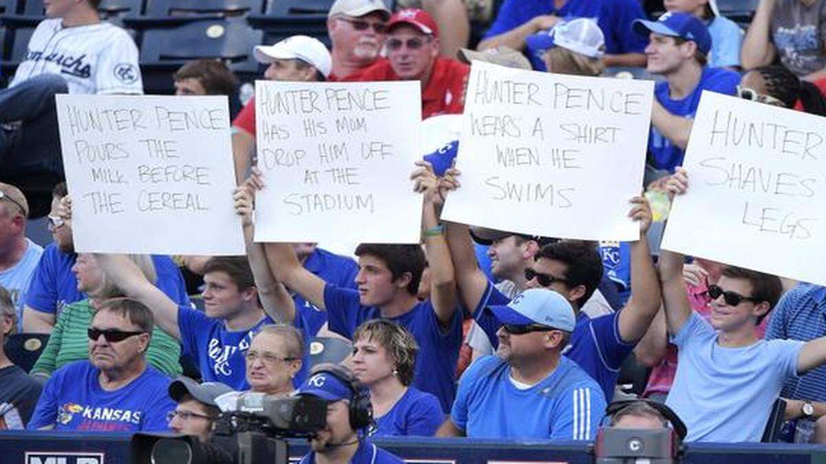 
Kansas City Royals fans display their signs about San Francisco Giants right fielder Hunter Pence during Saturday’s game.
