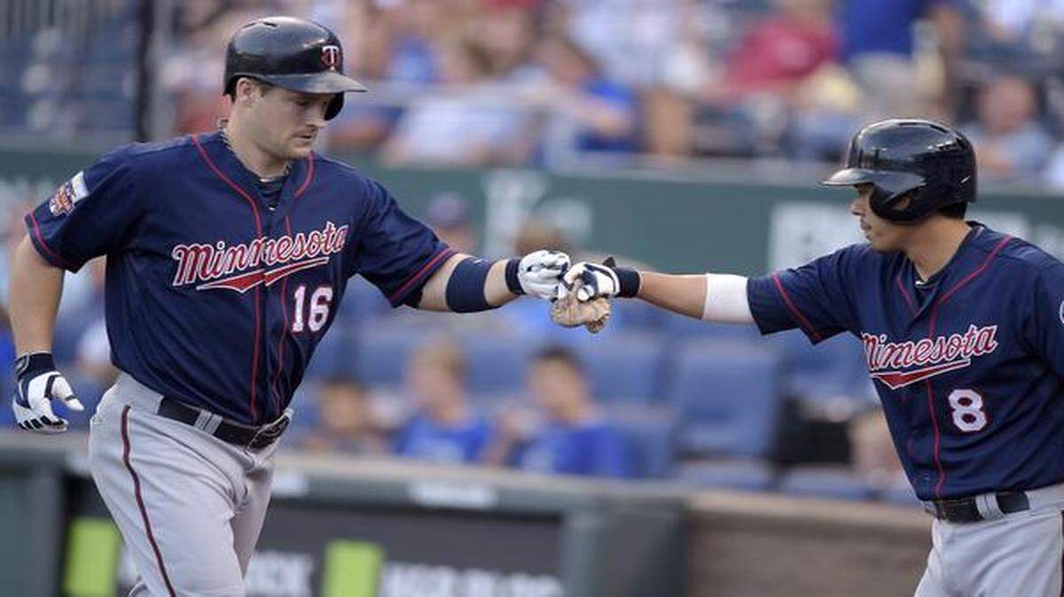 
Minnesota Twins designated hitter Josh Willingham (left) was congratulated by Kurt Suzuki after hitting a solo home run on July 30, 2014, at Kauffman Stadium.

