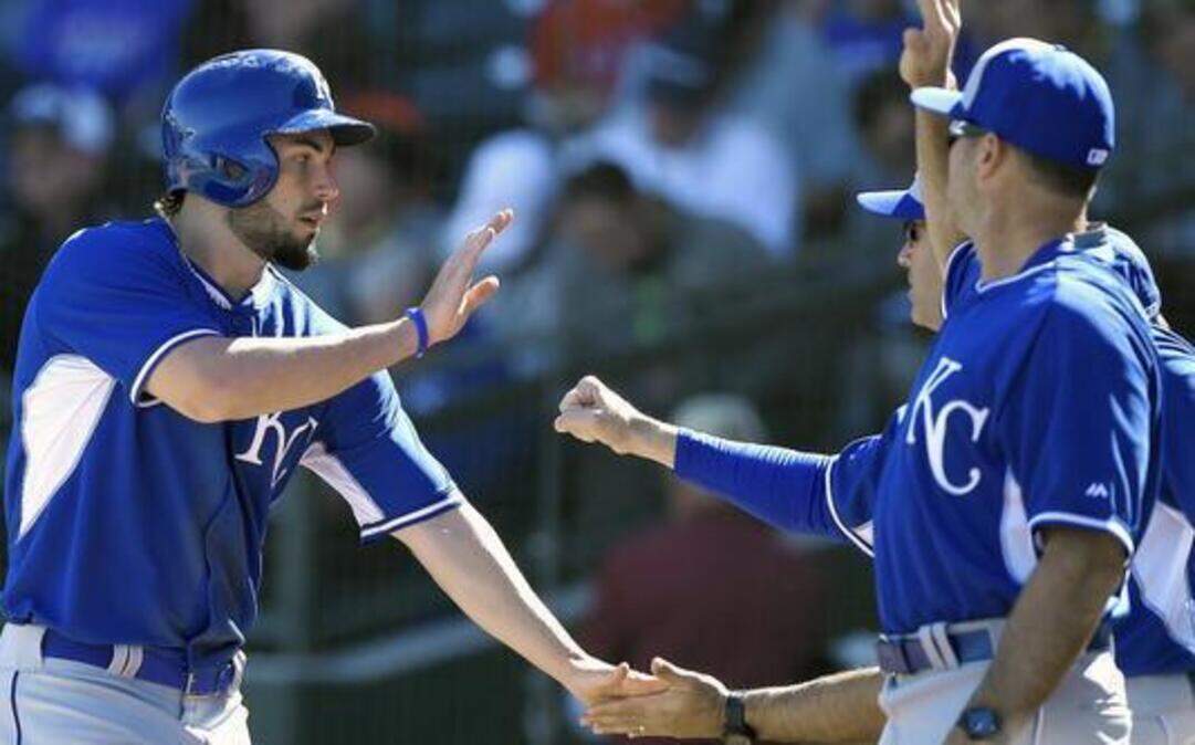 
Royals first baseman Eric Hosmer was congratulated after scoring on a grounder by Alex Rios in the fourth inning of Wednesday’s spring training game against the Texas Rangers.

