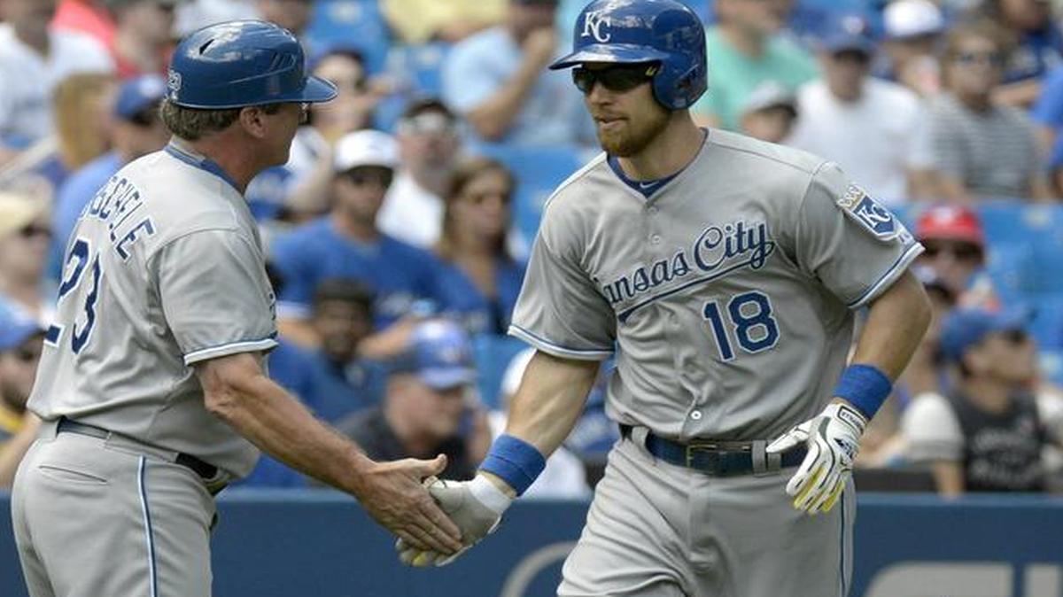 
The Royals’ Ben Zobrist (right) slapped hands with third base coach Mike Jirschele after hitting a home run against the Toronto Blue Jays on Saturday.
