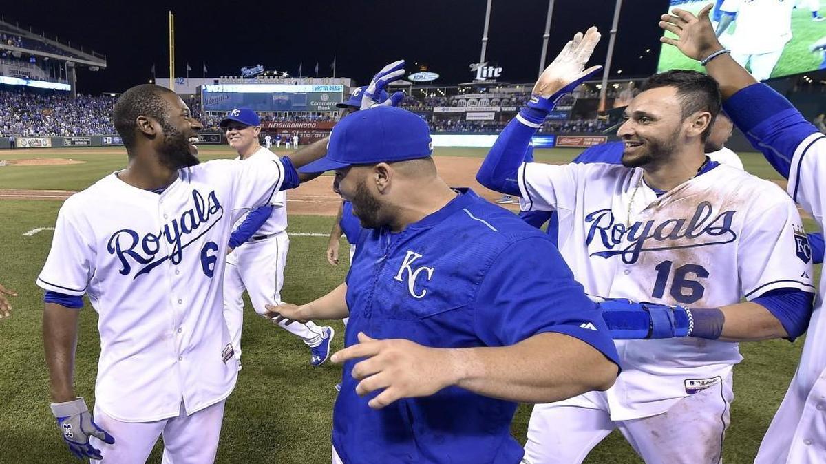 
Kansas City Royals outfielder Lorenzo Cain (left) celebrated with Kendrys Morales and Paulo Orlando after Cain’s game-winning hit in the 10th scored Orlando on Wednesday.
